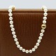 Ole Lynggaard; Clasp in 14k gold and white gold with pearl necklace Ole Lynggaard; Clasp in 14k gold and white gold with pearl necklace